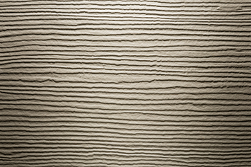 Hardie® Plank Aspect Cedar et couleur Taupe Monterey est une lame en ciment composite idéale pour la mise en oeuvre de bardage